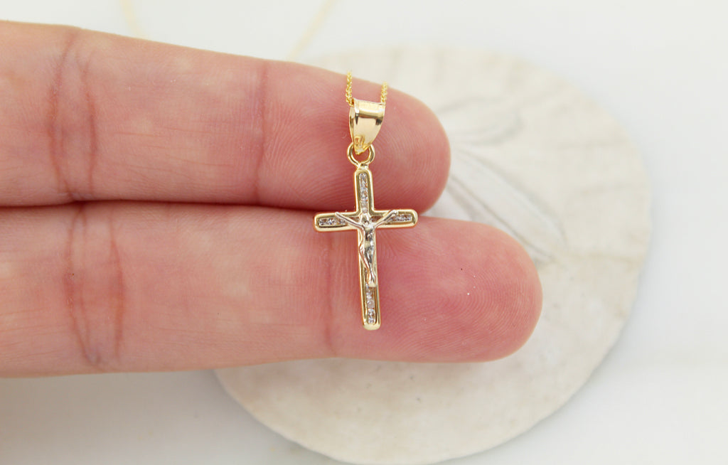 14K Gold Crucifix Pendant Necklace. The Crucifix pendant has Jesus on it along with Cubic Zirconias imbedded in it.
