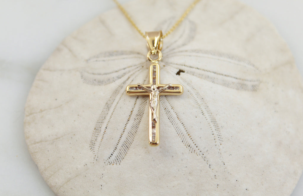 Beautiful 14K gold Crucifix pendant with Cubic Zirconias imbedded in the crucifix.