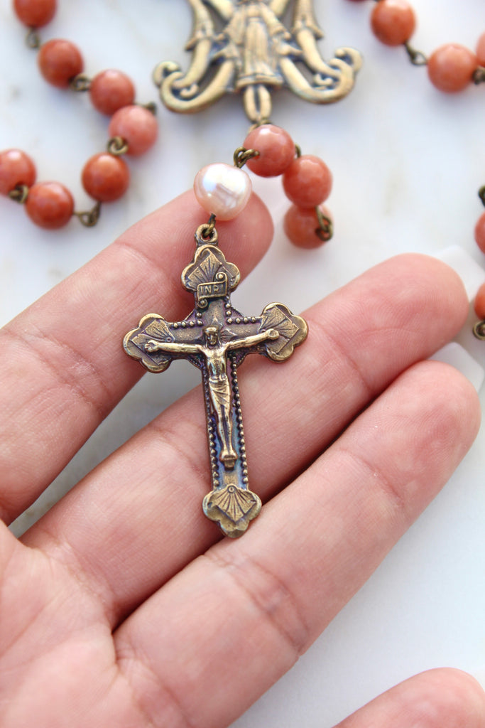 showing crucifix, rosary center and some of the coral stone beads.