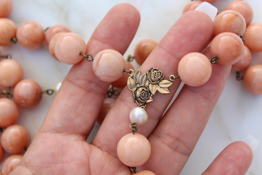 St. Therese Rosary has a Rosary Center made of 2 Solid Bronze Roses. Our Father Beads are fresh water pearls