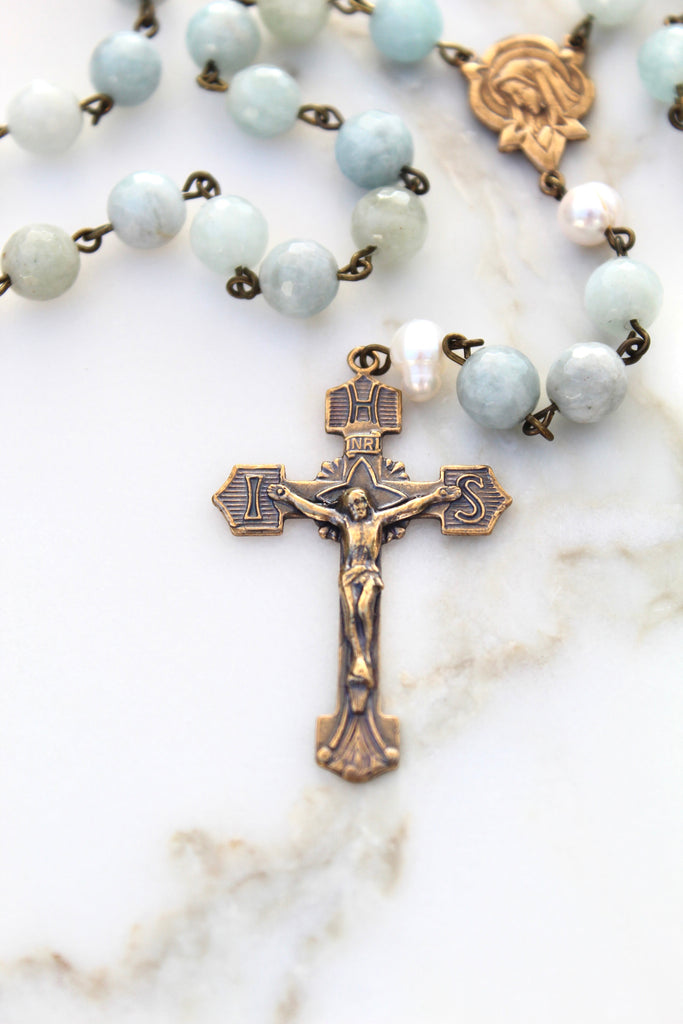 Blue Rosary made of stone and crucifix is made of bronze.