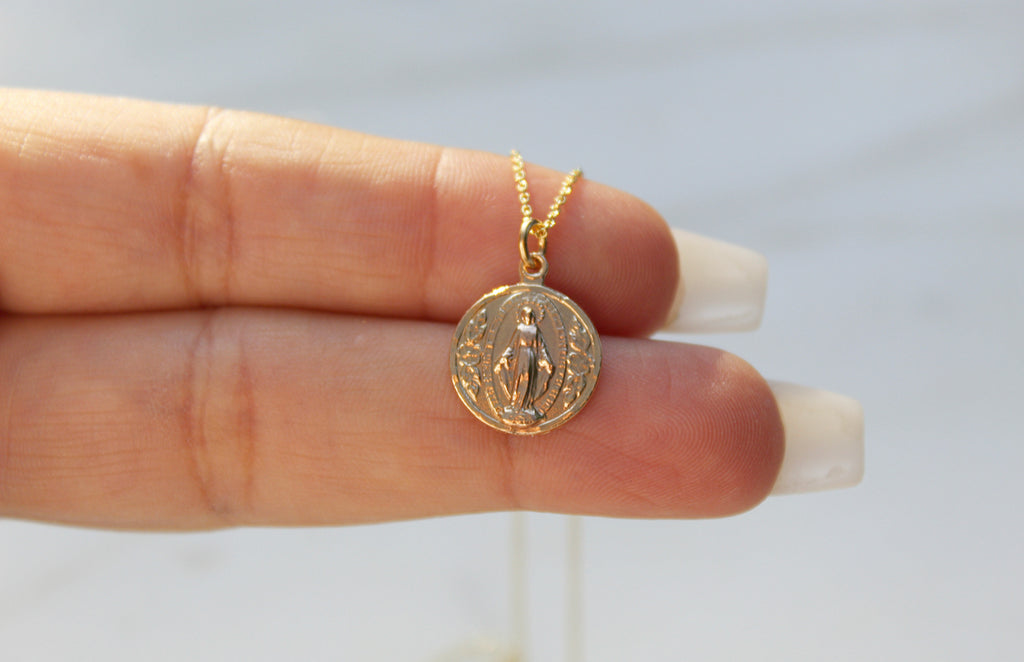 Classic Miraculous Medal.Handmade Miraculous Medal Necklace in 14K Gold. Medal is round. Chain is dainty Cable Chain. Medal Size on This Necklace is 5/16" x 1/2". Medal is Beautifully imperfect because it's handmade.