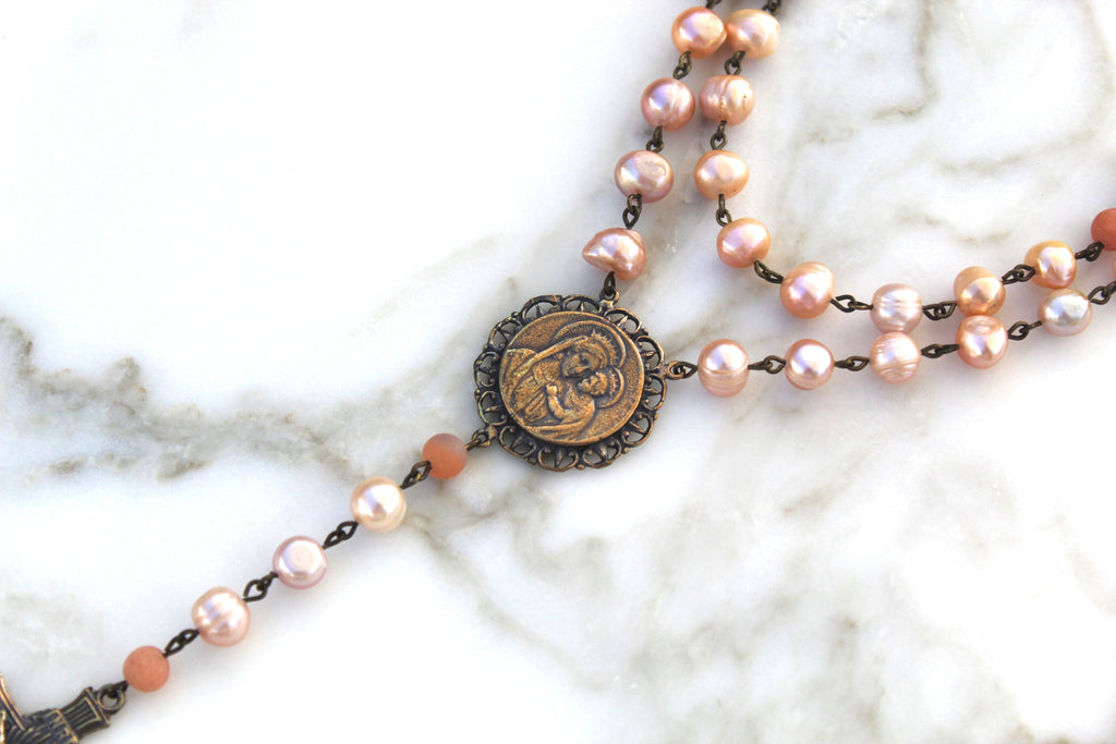 Fresh Water Pearl Rosary, pink toned, vary in color, shape, and size. Rosary Center is solid bronze.