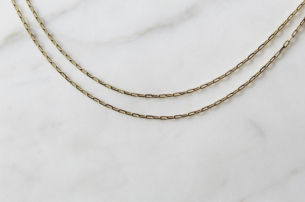 14K Gold Paper Clip Chain on a flat lay