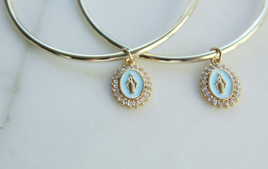 Gold Filled Hoop Earrings with Gold Filled Marian medals. Marian Medals have a beautiful powder blue enamel & there's a frame of tiny cubic zirconias around the entire medal. Medal Size: .43”x.30”. 