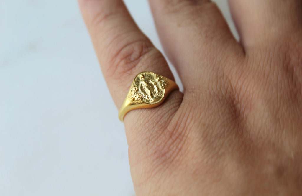 Catholic Signet Ring in Vermeil. It's a Miraculous Medal Signet ring. The from of the ring has mary with 6 roses, the inside has the MArian Cross with the stars and two sacred hearts. completely handmade in Southern California.