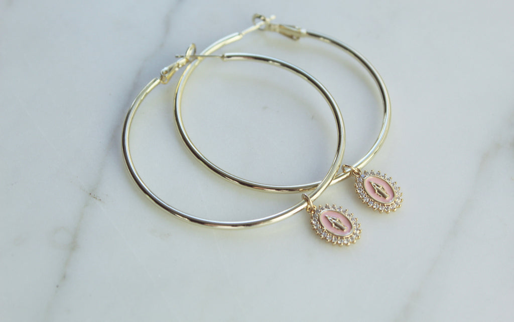 Gold Filled Hoop Earrings with Gold Filled Marian medals. Marian Medals have a beautiful powder pink enamel & there's a frame of tiny cubic zirconias around the entire medal. Medal Size: .43”x.30”. 