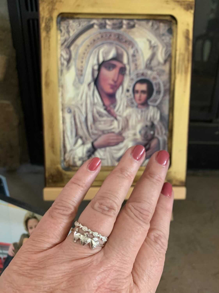Holy Family Hearts Ring in Sterling Silver. Ring has a simple round band. Ring has the Sacred Heart of Jesus, Immaculate Heart of Mary, chaste heart of st. joseph side by side with the Sacred Heart in the middle. Inside of ring is blank. Markings are expected in all handmade items.