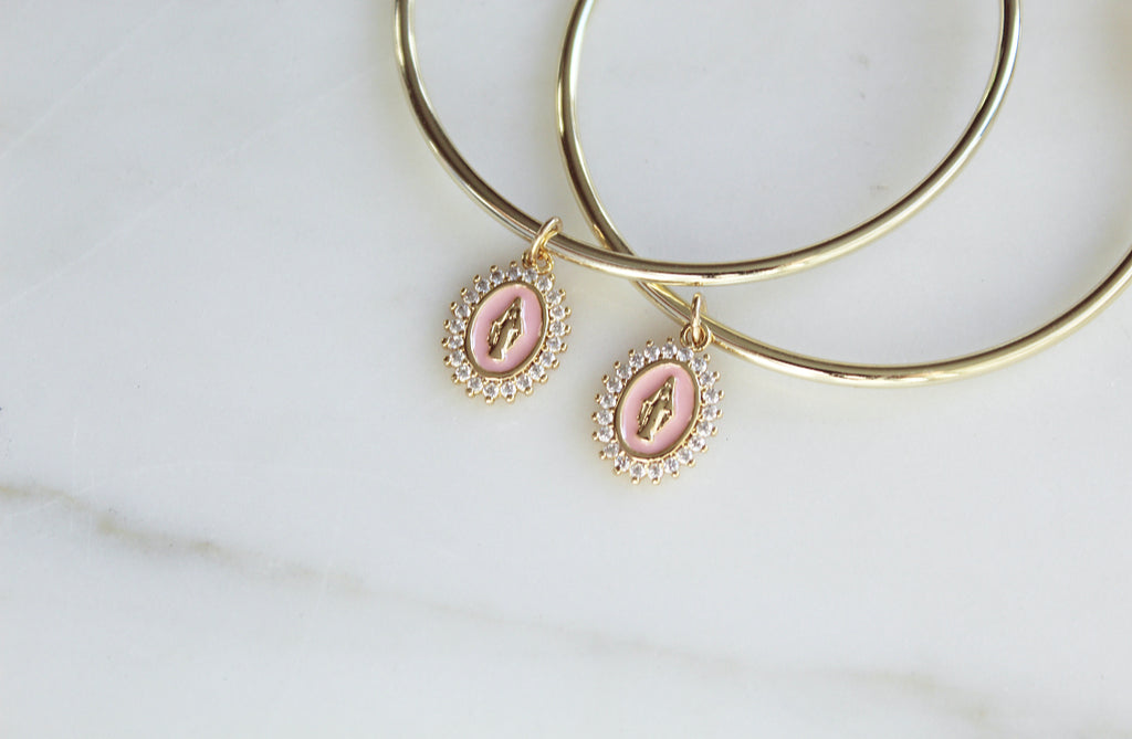 Gold Filled Hoop Earrings with Gold Filled Marian medals. Marian Medals have a beautiful powder pink enamel & there's a frame of tiny cubic zirconias around the entire medal. Medal Size: .43”x.30”. 