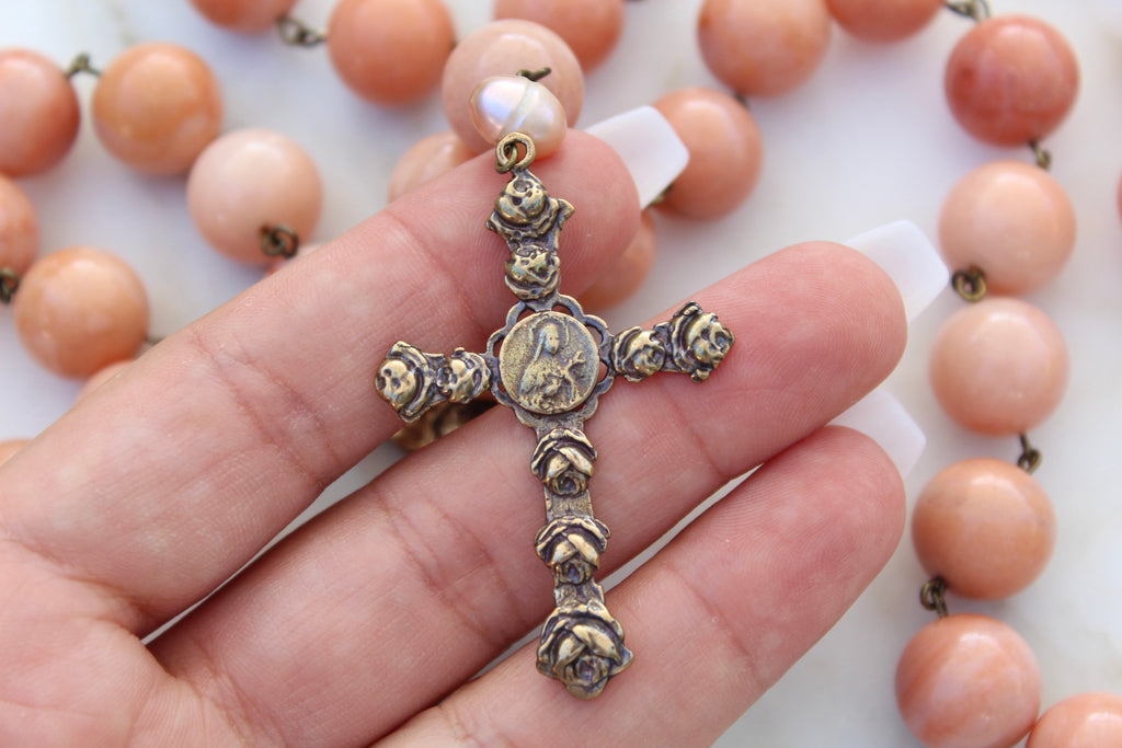 Picture showing the Rose St. Therese Cross to show the scale on the models hand. 